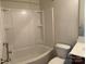 Clean bathroom with a tub, shower, and a sleek vanity, offering a spa-like experience at 1009 Dawn Light Rd, Indian Trail, NC 28079