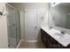 Bathroom featuring a double sink vanity, mirror, walk-in shower and tile flooring at 1009 Dawn Light Rd, Indian Trail, NC 28079