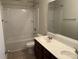 Bright bathroom with double sink vanity, tile flooring, and a shower-tub combination at 1009 Dawn Light Rd, Indian Trail, NC 28079