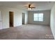 Spacious bedroom offers comfortable carpet, natural light from the window and a ceiling fan at 1009 Dawn Light Rd, Indian Trail, NC 28079