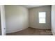 Neutral bedroom with carpet, window, and ample closet space at 1009 Dawn Light Rd, Indian Trail, NC 28079