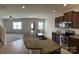 Open kitchen view featuring granite countertops, stainless appliances, and seamless flow into the living area at 1009 Dawn Light Rd, Indian Trail, NC 28079