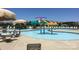 Community pool area featuring an umbrella water feature and plenty of lounge chairs for residents at 1009 Dawn Light Rd, Indian Trail, NC 28079