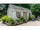 Well-maintained storage shed with landscaping and brick patio at 151 Middleton Pl, Mooresville, NC 28117