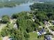 Aerial view showcasing waterfront homes nestled along the tree-lined shores of Lake Norman at 127 Palos Verde Rd, Mooresville, NC 28117