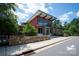 Inviting park entrance with modern architecture, stone accents, and lush greenery under a clear blue sky at 127 Palos Verde Rd, Mooresville, NC 28117