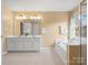 Double vanity bathroom with soaking tub and shower at 235 Coralstone Dr, Fort Mill, SC 29708