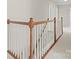 Upstairs hallway with wooden railing and carpet at 235 Coralstone Dr, Fort Mill, SC 29708