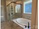 Bathroom with a soaking tub and a walk-in shower at 1770 Post Ct # Lot 510, Gastonia, NC 28054