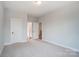 This bedroom features neutral walls, carpet and an open doorway to the closet and hallway at 1770 Post Ct # Lot 510, Gastonia, NC 28054