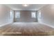 Large bedroom with three windows and carpeted floor at 1770 Post Ct # Lot 510, Gastonia, NC 28054