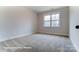 Spacious bedroom with neutral carpeting and large window at 1770 Post Ct # Lot 510, Gastonia, NC 28054