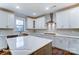 Modern kitchen with white cabinets and a large island at 1770 Post Ct # Lot 510, Gastonia, NC 28054