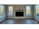 Bright living room with a built-in fireplace and large windows at 1770 Post Ct # Lot 510, Gastonia, NC 28054