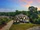 Beautiful home with a large backyard, basketball court, and lake views at 122 Long Cove Ln, Mooresville, NC 28117