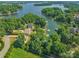 Aerial view of waterfront property with lush landscaping at 122 Long Cove Ln, Mooresville, NC 28117