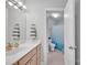 Clean bathroom featuring a tub, shower, toilet and single sink vanity, offering both functionality and style at 122 Long Cove Ln, Mooresville, NC 28117