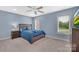 Upstairs bedroom with a ceiling fan and large window at 122 Long Cove Ln, Mooresville, NC 28117