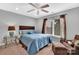 Cozy bedroom with window, seating area and ceiling fan at 122 Long Cove Ln, Mooresville, NC 28117