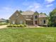 Beautiful home featuring a well-manicured lawn and tasteful landscaping at 122 Long Cove Ln, Mooresville, NC 28117