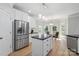 Stylish kitchen with stainless steel appliances, white cabinetry, and a breakfast nook with a view at 122 Long Cove Ln, Mooresville, NC 28117