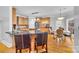 Kitchen with island, breakfast nook, stainless steel appliances, and hardwood floors at 122 Long Cove Ln, Mooresville, NC 28117