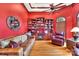 Cozy library with built-in bookshelves, fireplace, and leather seating at 122 Long Cove Ln, Mooresville, NC 28117