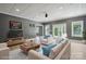 Spacious living room with neutral decor, stylish furniture, and ample natural light at 122 Long Cove Ln, Mooresville, NC 28117