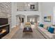 Inviting living room with stone fireplace, comfortable seating, and hardwood flooring at 122 Long Cove Ln, Mooresville, NC 28117