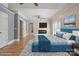 This main bedroom offers a fireplace and television, and is well lit by the large windows at 122 Long Cove Ln, Mooresville, NC 28117