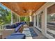 Cozy screened porch with comfortable seating and ceiling fan at 122 Long Cove Ln, Mooresville, NC 28117