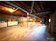 Unfinished basement with high ceilings and ample storage at 1506 Dallas Cherryville Hwy, Dallas, NC 28034