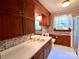 Full bathroom with wood cabinets and shower at 1506 Dallas Cherryville Hwy, Dallas, NC 28034