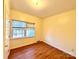 Spacious bedroom with hardwood floors and large windows at 1506 Dallas Cherryville Hwy, Dallas, NC 28034