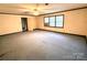 Bedroom with ceiling fan and carpet, offering natural light at 1506 Dallas Cherryville Hwy, Dallas, NC 28034