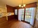 Kitchen dining area with wood flooring and access to a deck at 1506 Dallas Cherryville Hwy, Dallas, NC 28034