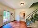 Light and airy entryway with wood floors and wreath at 1506 Dallas Cherryville Hwy, Dallas, NC 28034