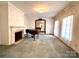 Bright living room featuring a grand piano and fireplace at 1506 Dallas Cherryville Hwy, Dallas, NC 28034