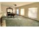 Bright living room featuring a grand piano and fireplace at 1506 Dallas Cherryville Hwy, Dallas, NC 28034