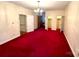 Main bedroom with red carpet and ample closet space at 1506 Dallas Cherryville Hwy, Dallas, NC 28034