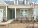 House entrance with a covered porch and landscaping at 1025 Bull Dog Ln # 5, Wingate, NC 28174