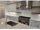 Modern kitchen with white cabinets, stainless steel appliances, and a large island at 13217 Terrace Court Dr, Charlotte, NC 28278