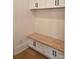 Mud room features custom built-in bench with shaker cabinets above and below at 13217 Terrace Court Dr, Charlotte, NC 28278