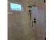 Modern shower with black hardware, white tile, and hexagon tile floor at 13217 Terrace Court Dr, Charlotte, NC 28278