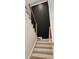 Modern staircase with light wood steps and dark metal railing at 13217 Terrace Court Dr, Charlotte, NC 28278