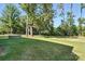 Extensive backyard space surrounded by mature trees, perfect for recreation and relaxation at 2027 Cedar Falls Dr # 75, Waxhaw, NC 28173