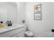 Chic half-bathroom with modern fixtures, decor, and a stylish vanity at 2027 Cedar Falls Dr # 75, Waxhaw, NC 28173
