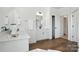 Bright bathroom featuring a double sink vanity and hardwood flooring at 2027 Cedar Falls Dr # 75, Waxhaw, NC 28173
