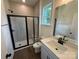 Modern bathroom with a glass-enclosed shower, tiled walls, and a stylish vanity at 2027 Cedar Falls Dr # 75, Waxhaw, NC 28173