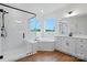 Bright bathroom featuring a glass shower, garden tub, and double vanity sinks with windows at 2027 Cedar Falls Dr # 75, Waxhaw, NC 28173